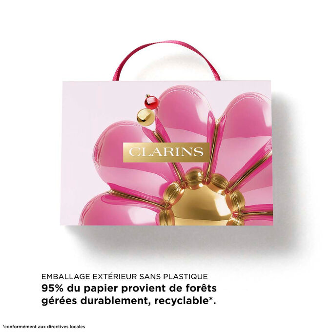 Coffret cadeau de No&euml;l Huiles &agrave; L&egrave;vres de Clarins avec texte mettant en valeur un &eacute;tui fabriqu&eacute; &agrave; partir de 87 % de fibres recycl&eacute;es pour un cadeau durable