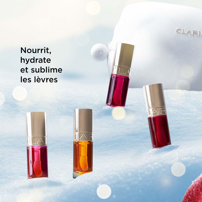 Plan produit du coffret cadeau de Noël Beauté de Clarins mettant en avant des huiles à lèvres qui nourrissent, hydratent et subliment les lèvres d’une brillance naturelle