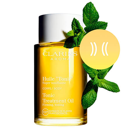 Tonic Body oil packshot with main ingredient Field mint extracts right next to it